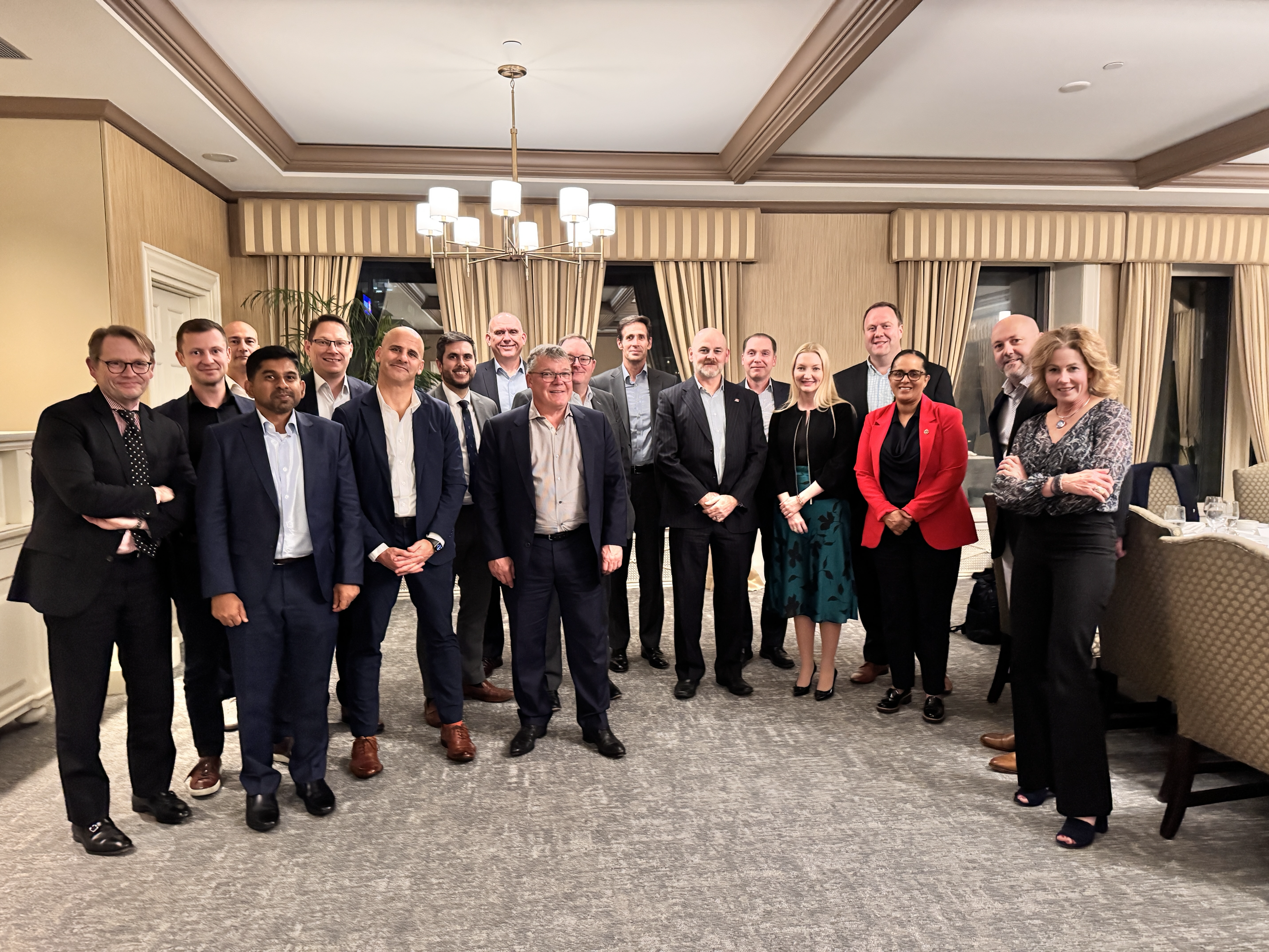 The image shows participants of the Cyber Ministerial Dinner standing together.